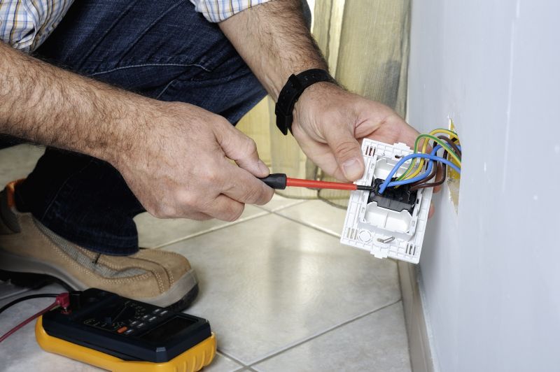 Electrician Repairing Outlets