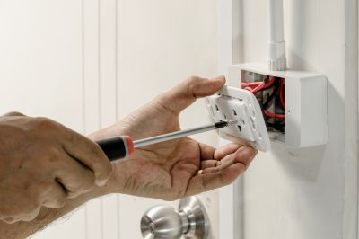 Electrician Repairing Outlets